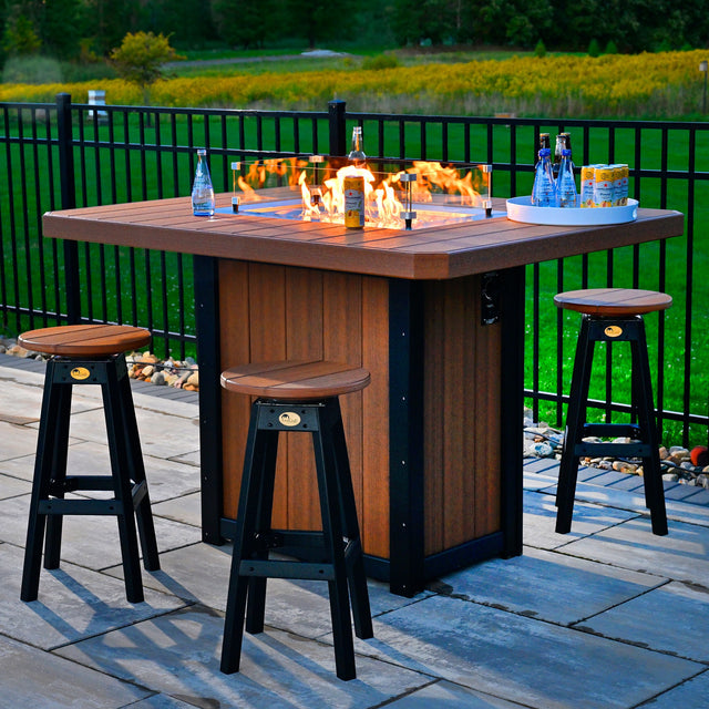 This is a lifestyle image showing the Antique Mahogany and Black colored fire pit table surrounded by matching stools.