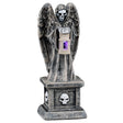 This image shows what this Lemax Spooky Town accessory looks like on a white background. It was designed to look like a tombstone with a skeletal angel on top. The angel is holding a small lantern with a purple light inside.
