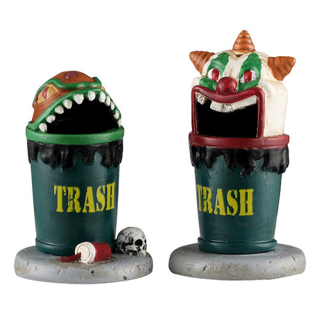 This image shows what these two Lemax Spooky Town accessories look like on a white background. They're designed to look like green trash cans.