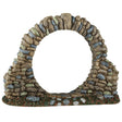 This image shows what this Lemax Spooky Town accessory looks like on a white background. It's designed to look like a circle (gateway) made of stones on a grassy patch.