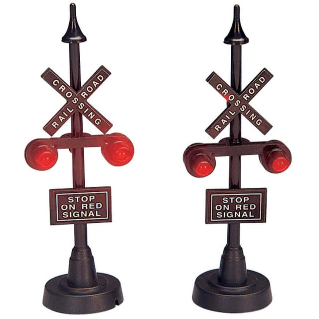 Village accessories for a Lemax display. Designed to look like two railroad crossing signs. They read "STOP ON RED SIGNAL."