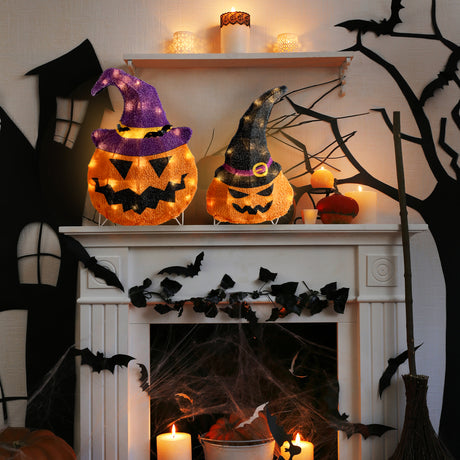 This is a lifestyle image showing these two decorative pumpkins on a mantel in a room decorated for Halloween.
