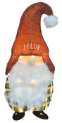 This image shows the gnome decoration on a white background. The gnome is wearing a red hat with a white poof and it reads "JOLLY." The gnome has a white beard and is wearing a green and white plaid outfit with black shoes. The LED lights are turned on.