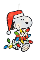 This image shows the Snoopy decoration on a white background. Snoopy is wearing a Santa hat and a Santa coat and is holding a string of multi-colored light bulbs.