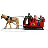 This image shows what the side of this table accent looks like. The horse is a light brown color and the reins are black. The sleigh is red and black.