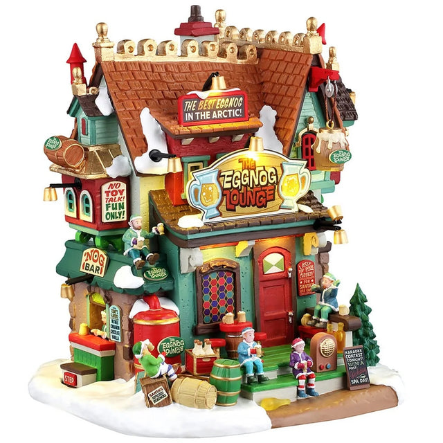 This image shows what this Lemax building looks like on a white background. It was designed to look like a uniquely decorated, tall restaurant. There's a sign on the roof that reads "The Best Eggnog in the Arctic!" There are elves sitting around, from the roof to the front stairs. There's snow on the roof and the sidewalk. There are lots of little signs everywhere.