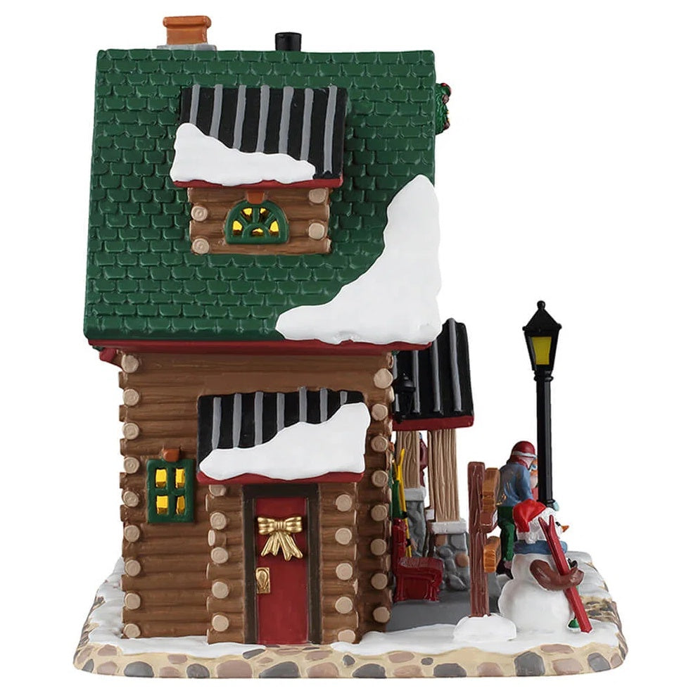 This image shows what the other side of this building looks like. There's a side door decorated with a large gold bow.