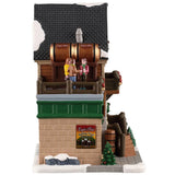 This image shows what the other side of this building looks like. You can see the people standing around on the balcony. There's a sign that reads "Eagle's Nest Holiday Treat Milk Stout."