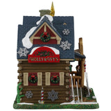 This image shows what this side of the building looks like. There are decorative snowflakes all over, as well as decorated wreaths. There's a big red sign that reads "Holly & Ivy's."