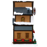This image shows what the other side of this building looks like. There's a green garland with red bows.