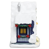 This image shows what the other side of the table accent looks like. There's a window decorated with garland and red bows.