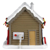 This image shows what the back of the building looks like. There's a wooden door and you can see the On/Off switch.