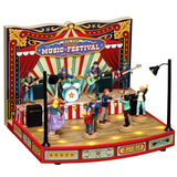 This image shows what this Lemax item looks like on a white background. It was designed to look like a band performing to a crowd of people dancing. The backdrop looks like a circus-type red tent and it reads "Big Top Holiday Music Festival."