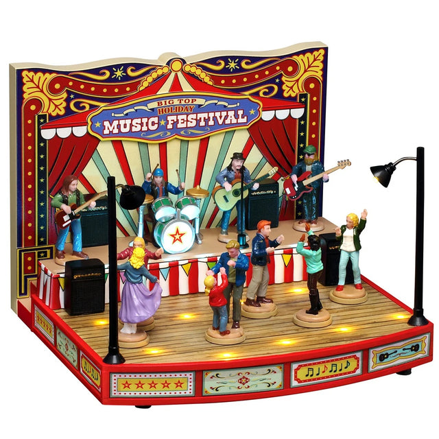 This image shows what this Lemax item looks like on a white background. It was designed to look like a band performing to a crowd of people dancing. The backdrop looks like a circus-type red tent and it reads "Big Top Holiday Music Festival."