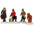 This image shows what these four figurines look like on a white background. The scene is supposed to look like a mom, her two kids and their dog shopping in the snow.