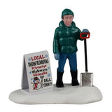 This image shows a young boy holding a shovel and standing in the snow next to a sign. He's wearing a teal knit hat, a teal puffy coat, blue jeans and black boots. The sign on the ground next to him reads "Local Snow Removal. Driveways, Walkways, Sidewalks. Call today!"