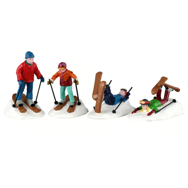 This image shows what these four Lemax Vail Village figurines look like on a white background. They were designed to look like skiers. 
