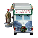This image shows what the van looks like head on. The front bumper is decorated with a wreath.