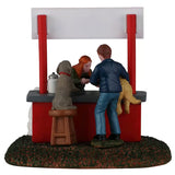 This image shows what this table piece looks like from the back. There's a dog sitting on a stool next to the man standing and holding the golden retriever.