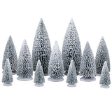 This image shows what these eleven Lemax Village trees look like on a white background. All of the trees are a dark green color that is painted white so the trees look like they're covered in snow. There are two large trees, five medium sized trees and four smaller trees.
