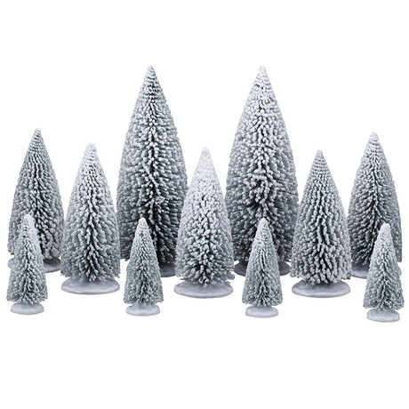 This image shows what these eleven Lemax Village trees look like on a white background. All of the trees are a dark green color that is painted white so the trees look like they're covered in snow. There are two large trees, five medium sized trees and four smaller trees.