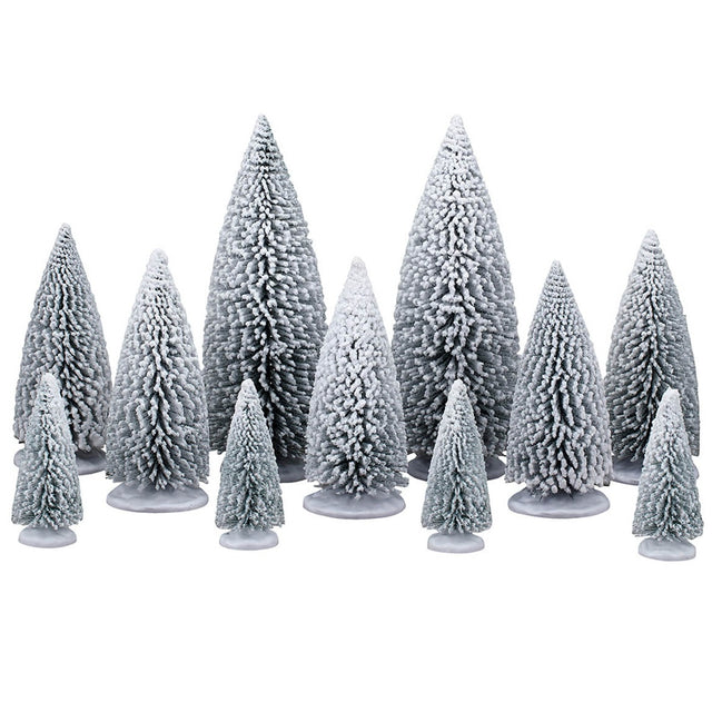 This image shows what these eleven Lemax Village trees look like on a white background. All of the trees are a dark green color that is painted white so the trees look like they're covered in snow. There are two large trees, five medium sized trees and four smaller trees.