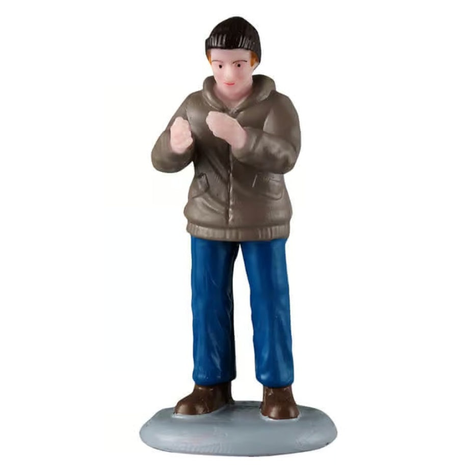 This figurine was designed to look like a man clapping. He's wearing a black hat, a light brown jacket, blue jeans and brown shoes.