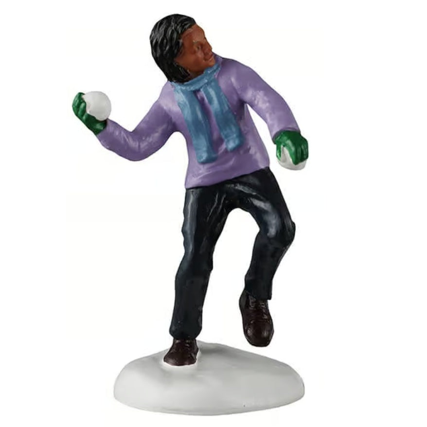 This figurine was designed to look like a boy throwing a snowball. He's wearing a purple sweater, a light blue scarf, green gloves, black pants and black shoes.