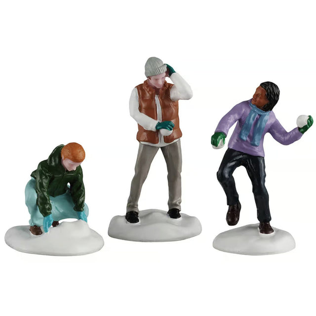 This image shows what these three Lemax General Collectible figurines look like on a white background. They were designed to look like a scene where three boys are in the middle of a snowball fight.