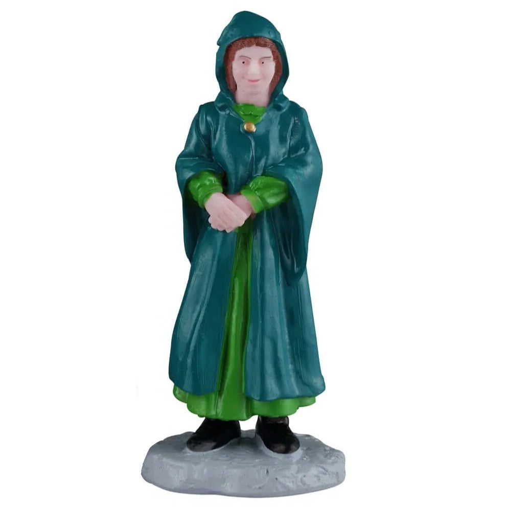 This is the woman figurine on a white background. She's wearing a teal colored robe, a green dress and black shoes.