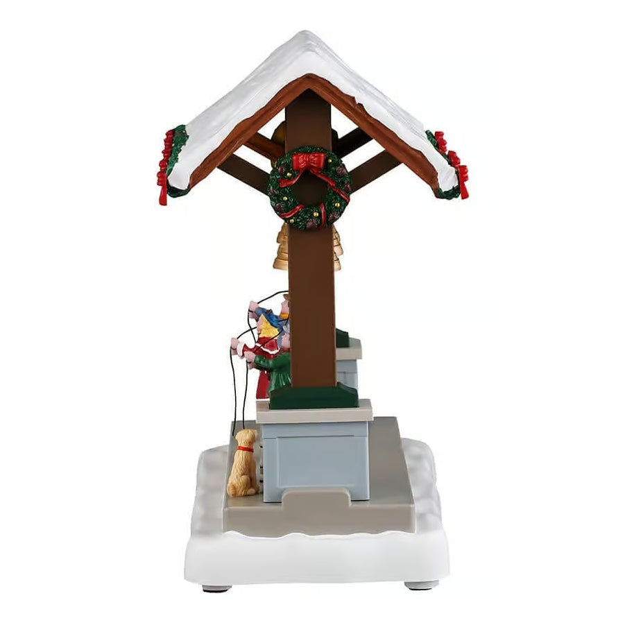 This image shows what this piece looks like from the side. The top near the roof is decorated with a wreath.