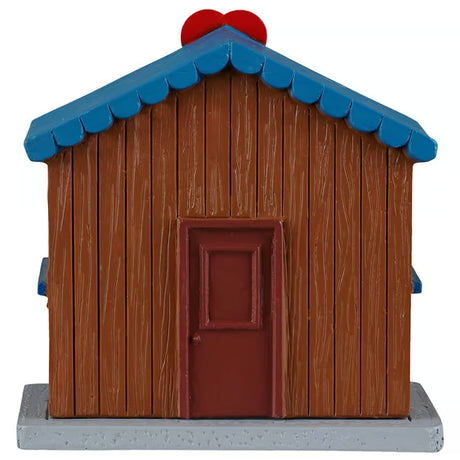 This image shows what the back of this table accent looks like. There's a brown door.