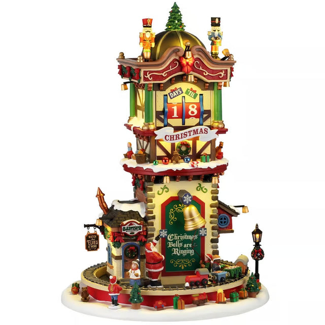 This image shows what this Lemax building looks like on a white background. It was designed to look like a tall Christmas-themed tower. There are nutcrackers and a tree on the roof. There's a countdown to Christmas and there are lots of wrapped presents everywhere. Santa is at the base of the tower, where a toy train goes in circles.
