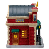 This image shows what the other side of this building looks like. There's a door with a yellow sign that reads "Garage Employees Only."