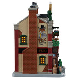 This image shows what the side of this building looks like. There's a mural on the wall of a fox wearing a top hat and it reads "The Fox invites you..."
