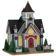 This image shows what this Lemax building looks like on a white background. It was designed to look like a large chapel. The chapel is decorated with red bows and wreaths. There are three stained glass windows. There's a sign on a table that reads "Bake Sale Fundraiser."