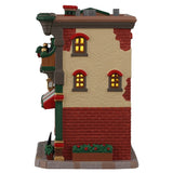 This image shows what the other side of this building looks like. There are three windows. There's also a planter with flowers on the ground.