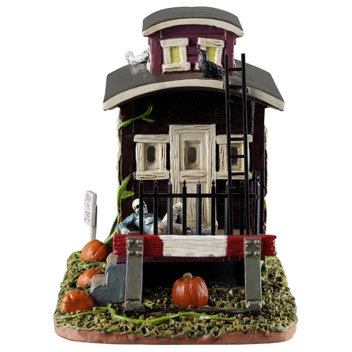 This image shows what the caboose looks like from a different angle. There's a skeleton resting on the deck of the train.