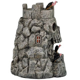 This image shows what the other side of the castle looks like. There's a small window where you can see the orange glow inside.
