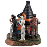 This image shows what this piece looks like from the side. You can see that Dracula and the skeleton are eating pizza.
