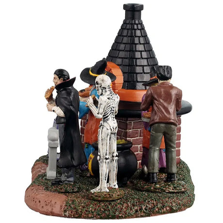 This image shows what this piece looks like from the side. You can see that Dracula and the skeleton are eating pizza.