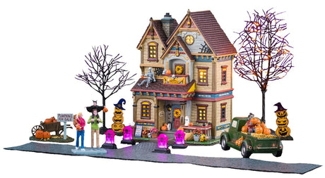 This image shows what this Lemax Spooky Town house set looks like all set up on a white background.