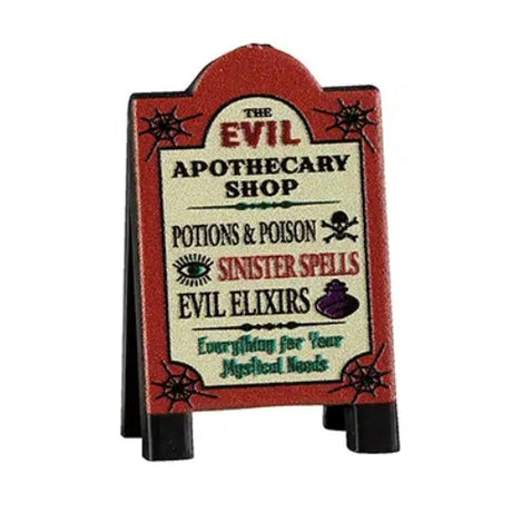 This Lemax sign is a burnt orange color, as well as a pale yellow, black and dark green. It reads "The Evil Apothecary Shop. Potions & poison. Sinister spells. Evil elixirs. Everything for your mystical needs."