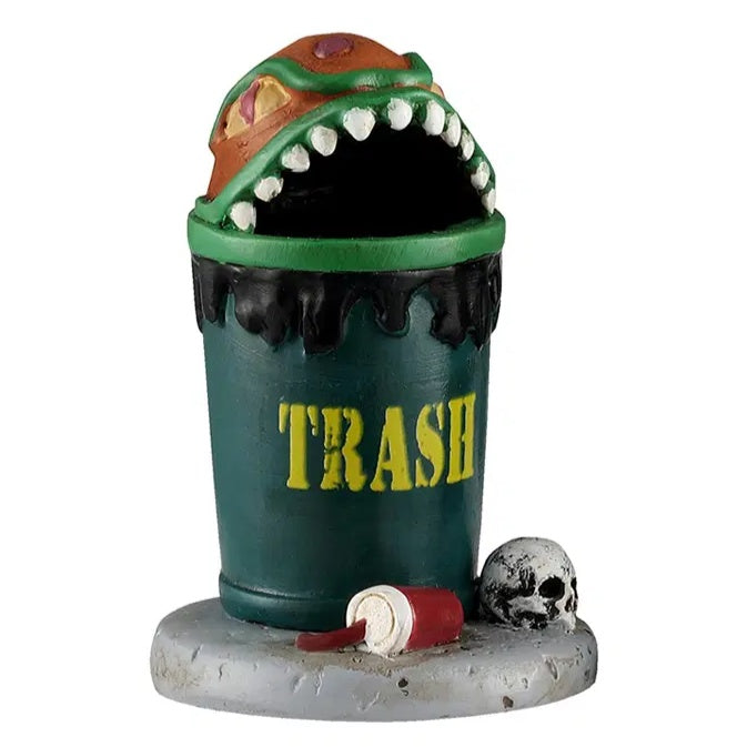 This trash can has a top that was designed to look like an orange bug with sharp teeth and red eyes. There's a red cup discarded on the ground next to the can, along with a skull.