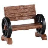 This image shows one of the wooden benches with the wheel armrests.