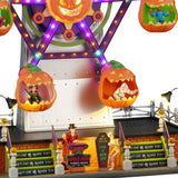 This is an up close view of the carnival ride. There are people in costumes riding the ride. One is dressed like a witch and another is dressed like a mummy.