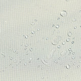 This is an up close image of the fabric with some water droplets on it to show that it's waterproof.