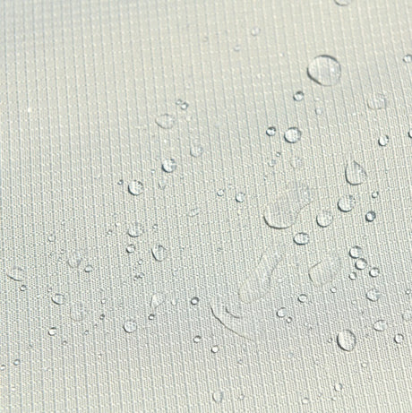 This is an up close image of the fabric with some water droplets on it to show that it's waterproof.