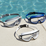 This is a lifestyle image showing all three of the color options for this swim mask on the edge of a pool.