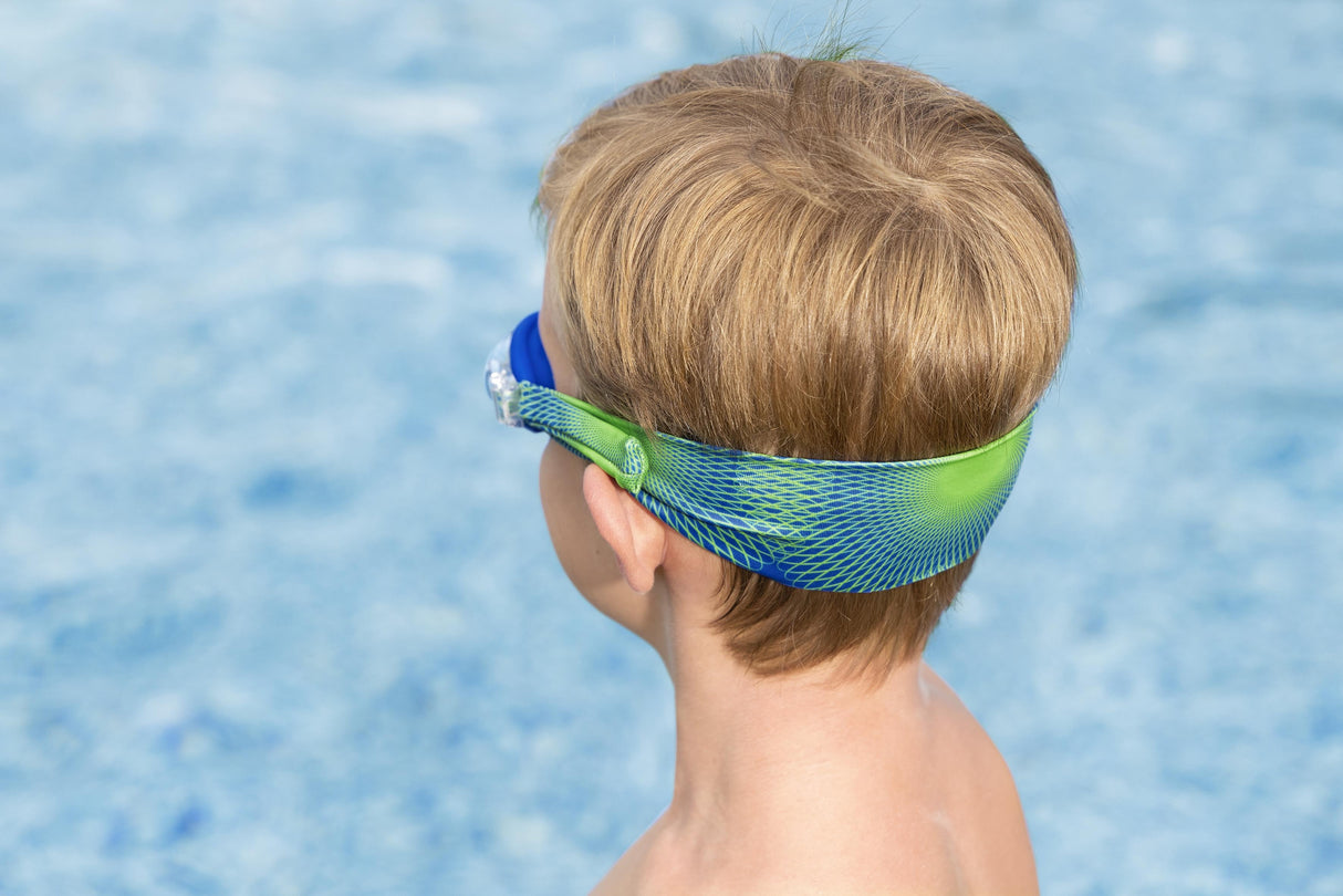 This is a lifestyle image showing the back of a young boy's head wearing the goggles. It shows off the unique stretchy lycra fabric design, in the blue and lime green color option.
